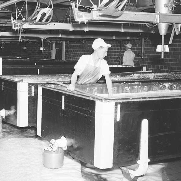 a historical photo of a man working at Roberts Dairy